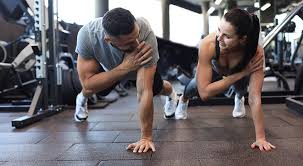 Toning Bingo Wings: Your Ultimate Guide to Sculpting Sleek Arms at the Gym 3 Fitness trainer demonstrating arm toning exercises Berkshire