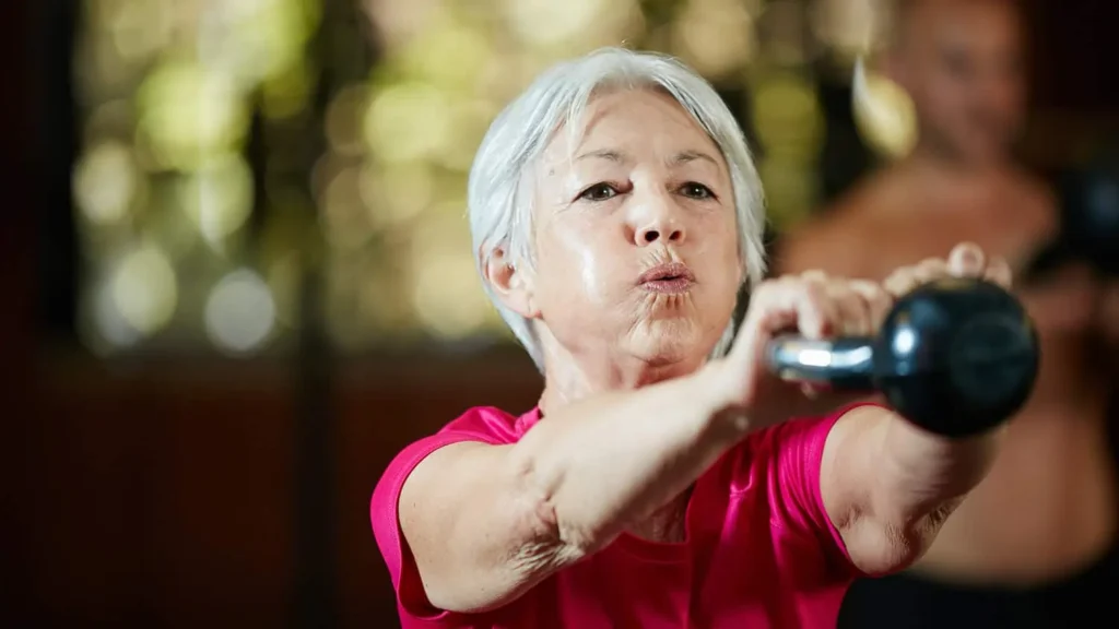 Toning Bingo Wings: Effective Exercises and Tips for Achieving Sleeker Arms 2 Person performing arm exercises with dumbbells Berkshire